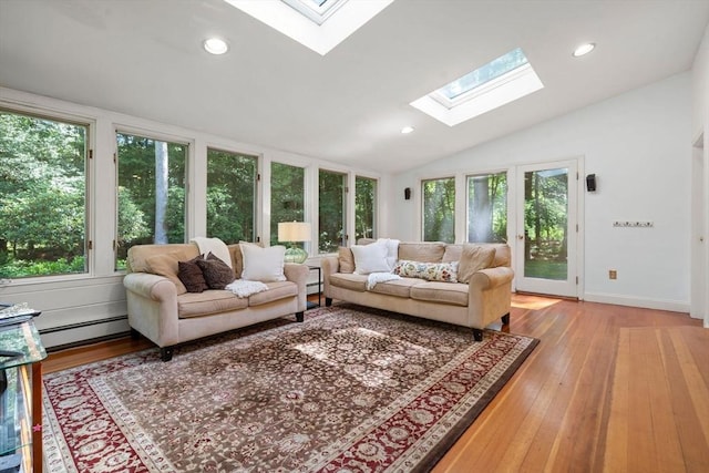 11 Laurel Dr, Scituate, MA 02066 - living area featuring a skylight, a baseboard heating unit, vaulted ceiling, wood finished floors, and recessed lighting