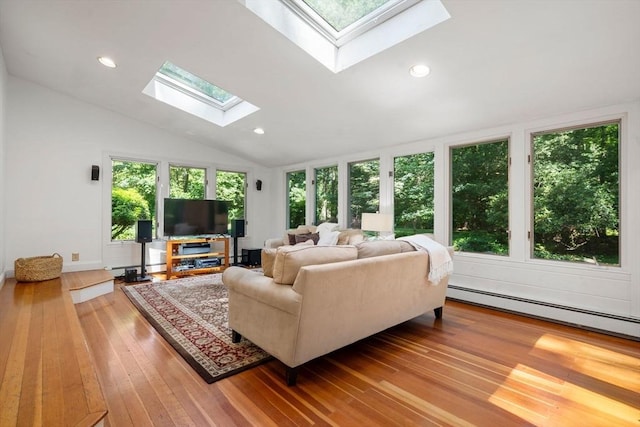11 Laurel Dr, Scituate, MA 02066 - living room featuring a skylight, wood-type flooring, lofted ceiling, recessed lighting, and a baseboard radiator