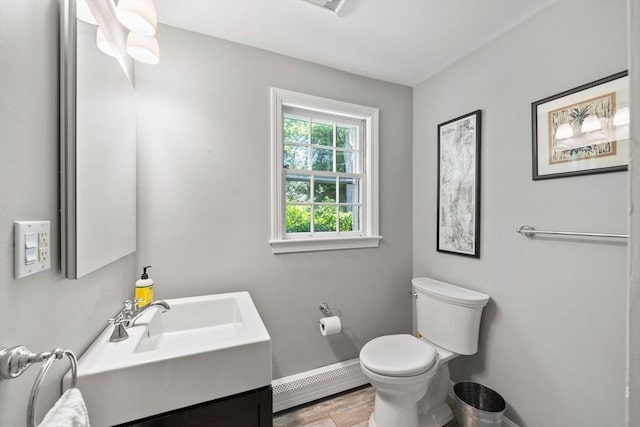 11 Laurel Dr, Scituate, MA 02066 - half bath featuring a baseboard heating unit and vanity