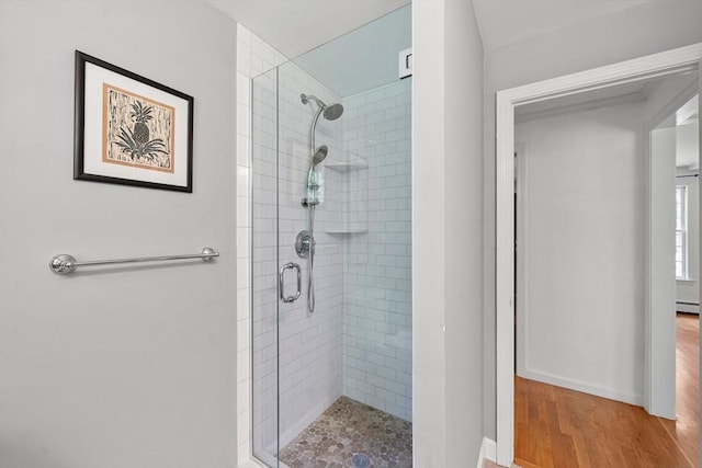 11 Laurel Dr, Scituate, MA 02066 - bathroom featuring a stall shower, wood finished floors, and a baseboard heating unit