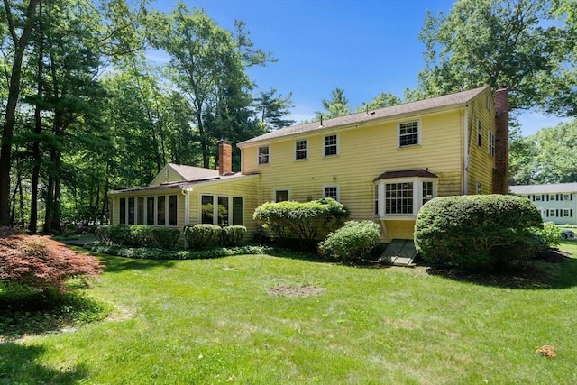 11 Laurel Dr, Scituate, MA 02066 - rear view of property featuring a chimney and a lawn