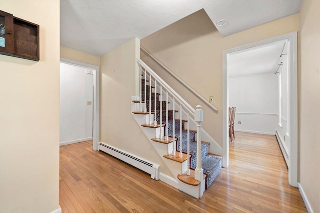 11 Laurel Dr, Scituate, MA 02066 - stairs featuring a baseboard radiator and hardwood / wood-style flooring