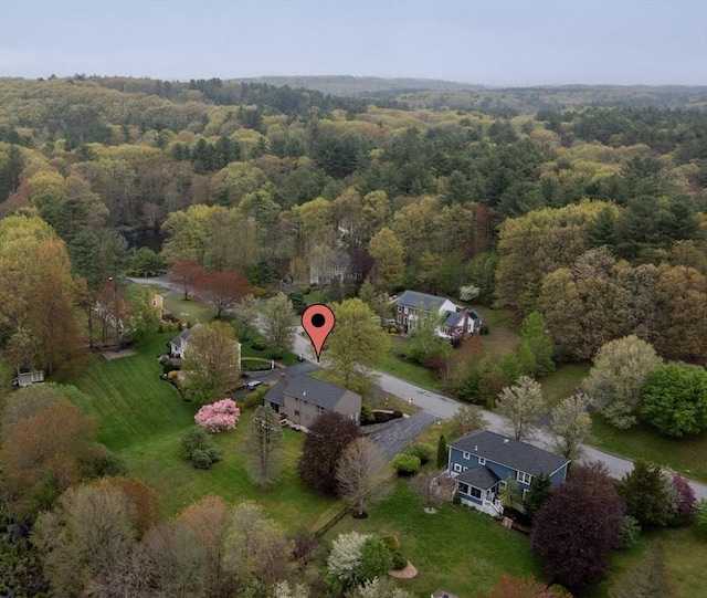 aerial overview of property's location featuring a forest