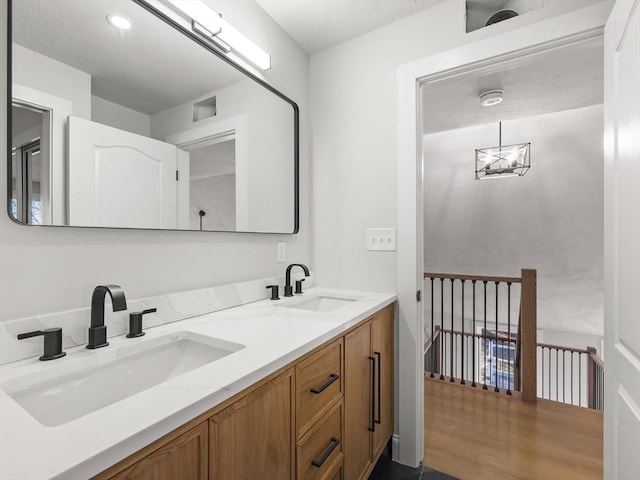 bathroom with vanity and wood-type flooring