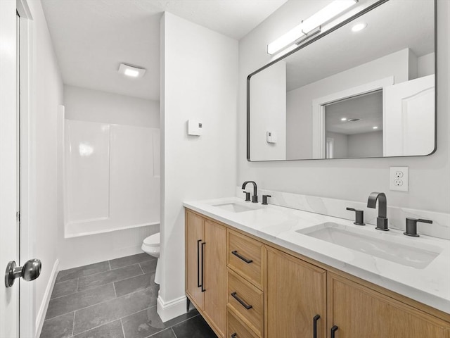 full bathroom featuring tile patterned flooring, vanity, toilet, and shower / bath combination