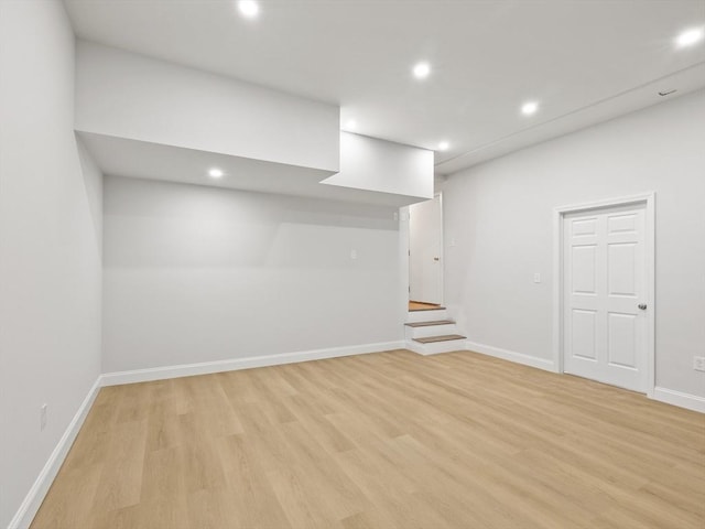 basement featuring light hardwood / wood-style flooring