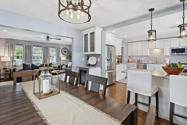 48 W Park Dr, Wakefield, MA 01880 - dining room featuring dark wood-style floors, recessed lighting, a chandelier, and ceiling fan