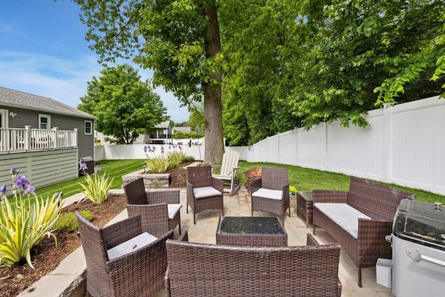 48 W Park Dr, Wakefield, MA 01880 - fenced backyard with a patio area, an outdoor hangout area, and a grill