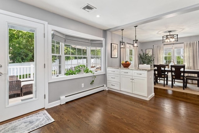 48 W Park Dr, Wakefield, MA 01880 - kitchen featuring baseboard heating, white cabinetry, light stone counters, a peninsula, and dark wood-style flooring