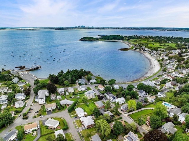 birds eye view of property with a water view and a residential view