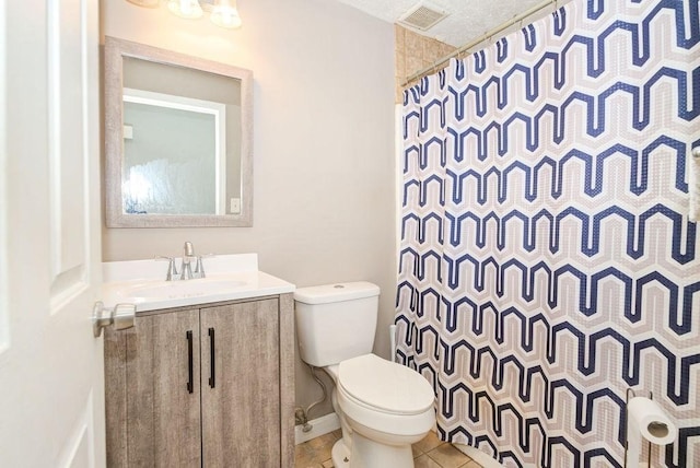 39 Lantern Ln Unit 7, Dracut, MA 01826 - full bathroom featuring toilet, vanity, tile patterned floors, and curtained shower