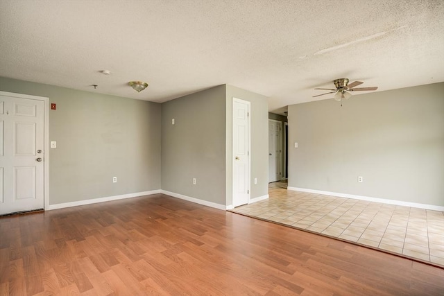39 Lantern Ln Unit 7, Dracut, MA 01826 - unfurnished room featuring ceiling fan, wood finished floors, a textured ceiling, and baseboards