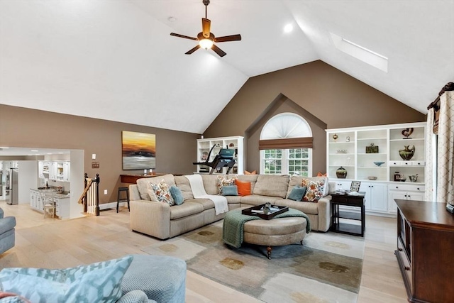 1 Preston Cir, Andover, MA 01810 - living room with a skylight, a ceiling fan, vaulted ceiling, and light wood finished floors