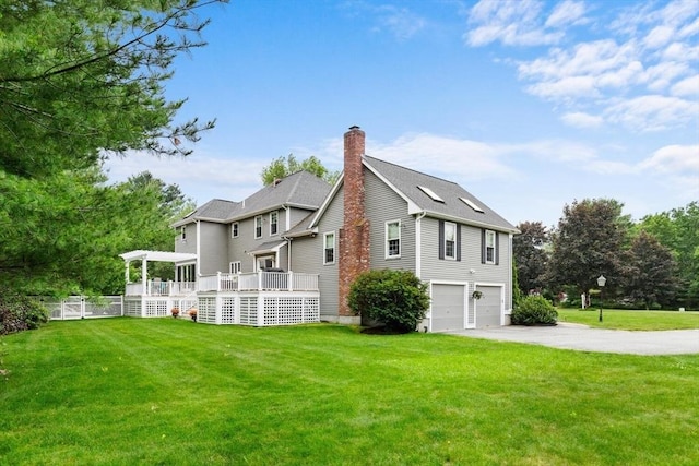 1 Preston Cir, Andover, MA 01810 - view of side of home with a garage, a wooden deck, driveway, and a chimney