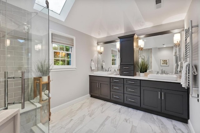 1 Preston Cir, Andover, MA 01810 - bathroom with a skylight, double vanity, marble look tile flooring, and a tile shower