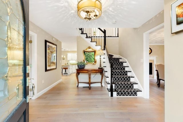 1 Preston Cir, Andover, MA 01810 - entryway featuring stairs, light wood-style flooring, and a chandelier
