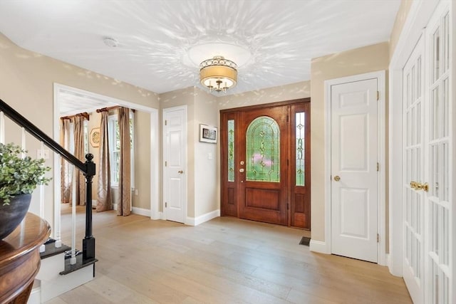1 Preston Cir, Andover, MA 01810 - foyer entrance featuring plenty of natural light, light wood finished floors, and stairs