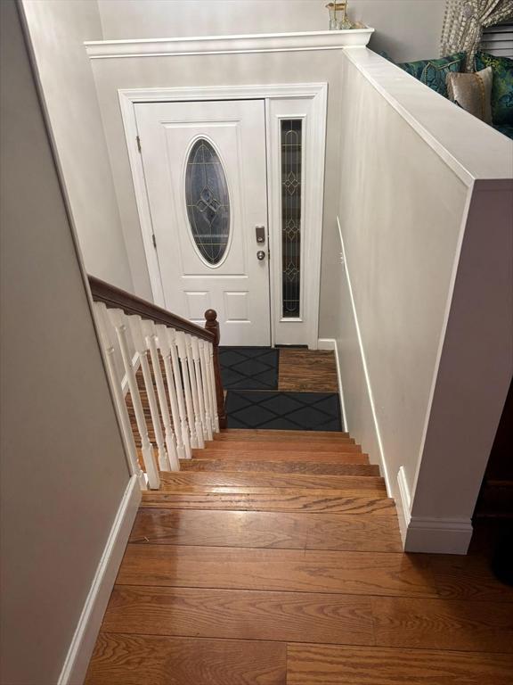 staircase featuring hardwood / wood-style floors