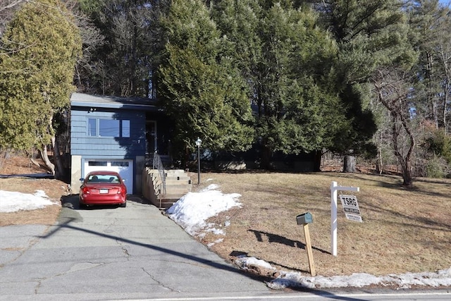 view of front of property with driveway and an attached garage