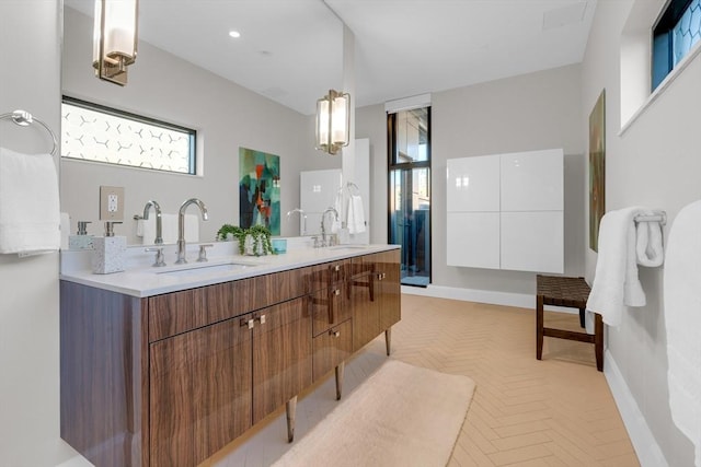 140 Shawmut Ave Unit 5A, Boston, MA 02118 - bathroom featuring double vanity and baseboards