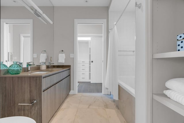 140 Shawmut Ave Unit 5A, Boston, MA 02118 - bathroom featuring marble look tile flooring, double vanity, and shower / bath combo with shower curtain