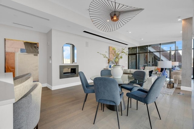 140 Shawmut Ave Unit 5A, Boston, MA 02118 - dining space featuring baseboards, a fireplace, wood finished floors, and recessed lighting