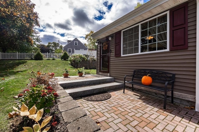 view of patio / terrace featuring fence
