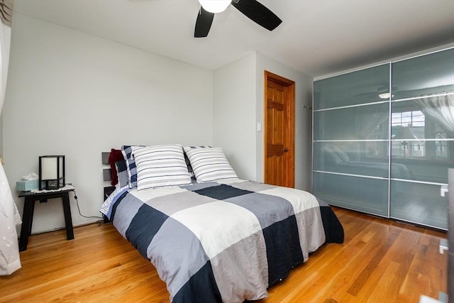 bedroom with ceiling fan and wood finished floors