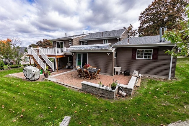 back of property featuring a patio, a yard, a deck, and stairway