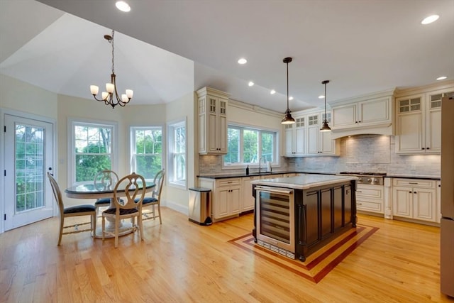 10 Damon Rd, Needham, MA 02494 - kitchen featuring wine cooler, light wood-style floors, backsplash, recessed lighting, and lofted ceiling