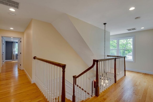 10 Damon Rd, Needham, MA 02494 - hallway with an upstairs landing, light wood-type flooring, baseboards, and recessed lighting