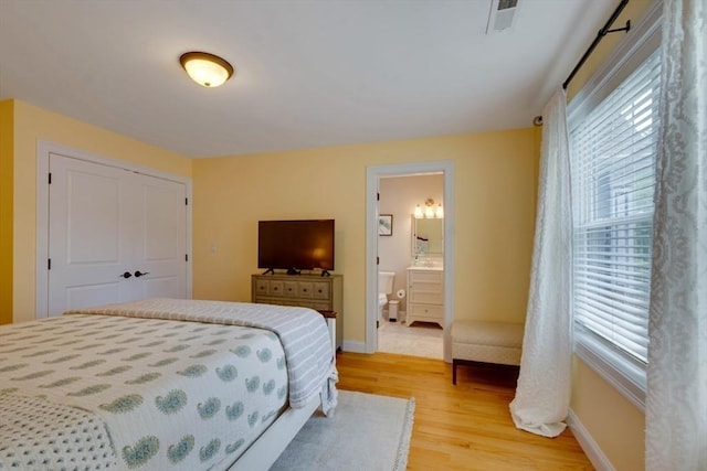 10 Damon Rd, Needham, MA 02494 - bedroom featuring light wood-style floors, baseboards, a closet, and ensuite bath