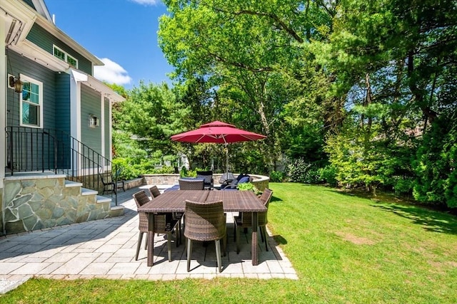 10 Damon Rd, Needham, MA 02494 - view of grassy yard with a patio and outdoor dining area
