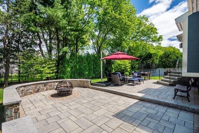 10 Damon Rd, Needham, MA 02494 - view of patio featuring a fire pit and a trampoline