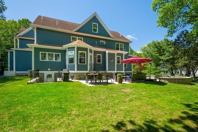 10 Damon Rd, Needham, MA 02494 - rear view of house featuring a patio and a yard