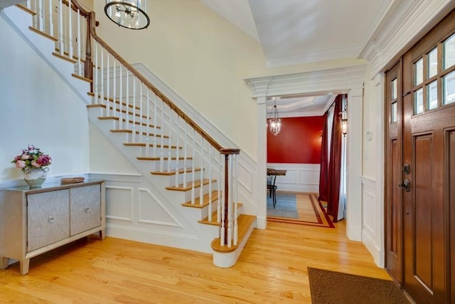 10 Damon Rd, Needham, MA 02494 - entrance foyer with a decorative wall, stairs, light wood-type flooring, a wainscoted wall, and ornamental molding