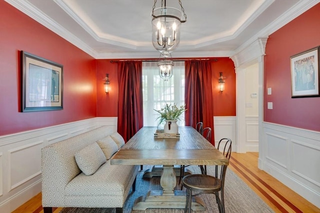 10 Damon Rd, Needham, MA 02494 - dining room with a chandelier, wood finished floors, a raised ceiling, a wainscoted wall, and ornamental molding