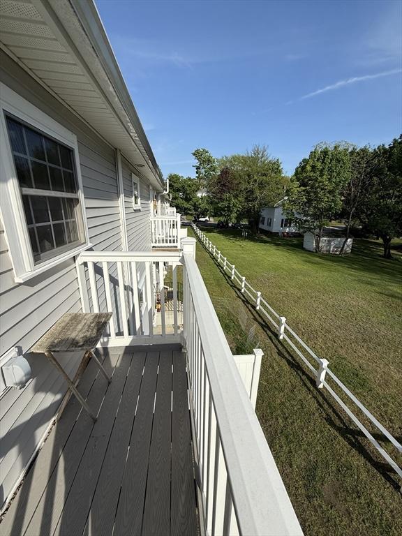 146 Main St Unit 2D, Clinton, MA 01510 - wooden terrace featuring a yard