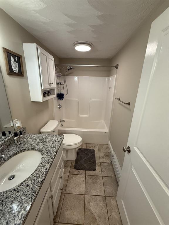146 Main St Unit 2D, Clinton, MA 01510 - bathroom featuring toilet, washtub / shower combination, vanity, tile patterned floors, and baseboard heating