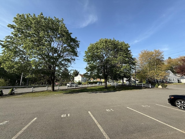 146 Main St Unit 2D, Clinton, MA 01510 - uncovered parking lot featuring fence