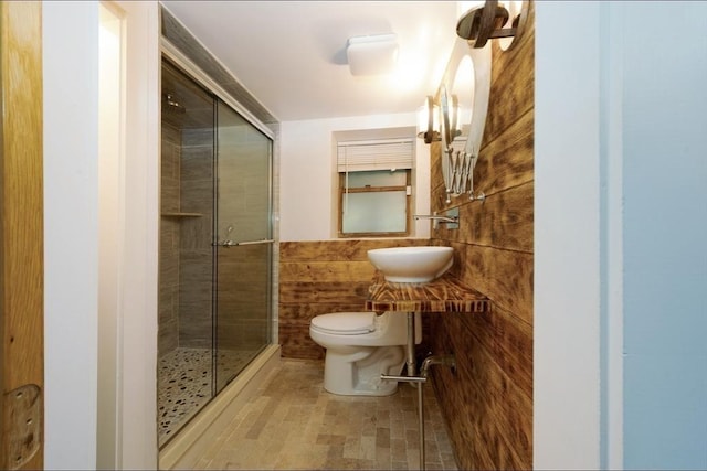 67 Raymond Rd, Plymouth, MA 02360 - bathroom featuring a shower stall and wooden walls
