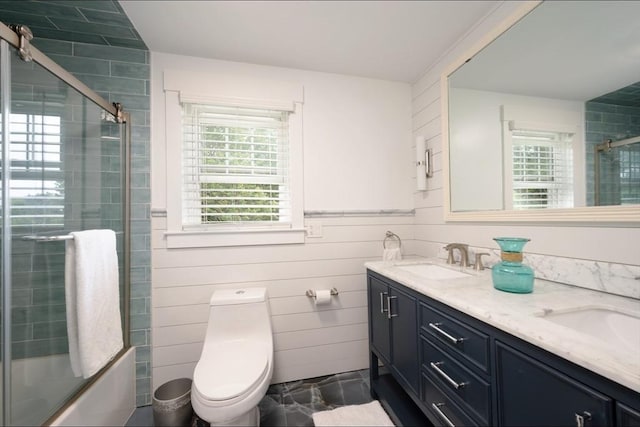 67 Raymond Rd, Plymouth, MA 02360 - full bathroom featuring double vanity and combined bath / shower with glass door