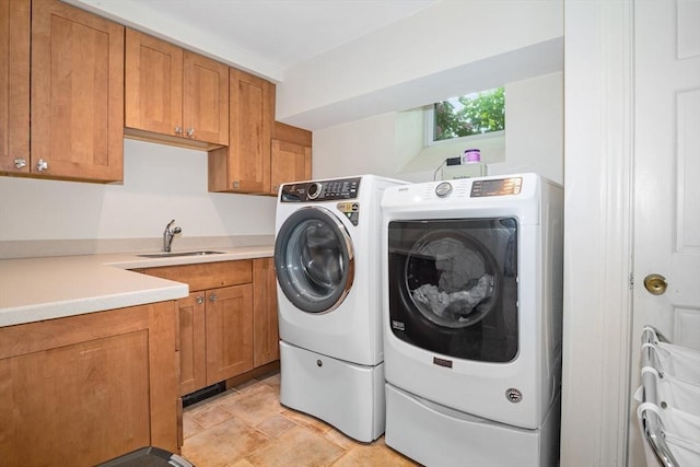 19 Whittier Rd, Wellesley, MA 02481 - washroom featuring washing machine and dryer, cabinet space, and light stone finish floors
