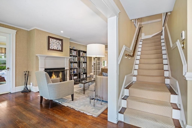 19 Whittier Rd, Wellesley, MA 02481 - stairway with wood finished floors, a warm lit fireplace, ornamental molding, and baseboards