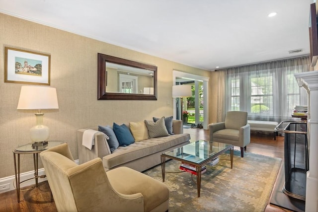 19 Whittier Rd, Wellesley, MA 02481 - living room with wood finished floors, baseboards, and ornamental molding