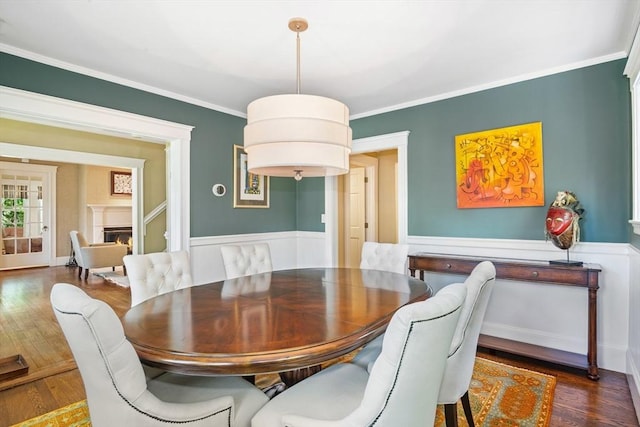 19 Whittier Rd, Wellesley, MA 02481 - dining room featuring wood finished floors, ornamental molding, and a warm lit fireplace