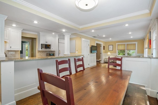 19 Whittier Rd, Wellesley, MA 02481 - dining space with decorative columns, ornamental molding, dark wood-style flooring, and recessed lighting