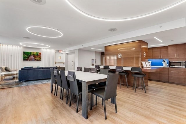 dining room with light wood-type flooring