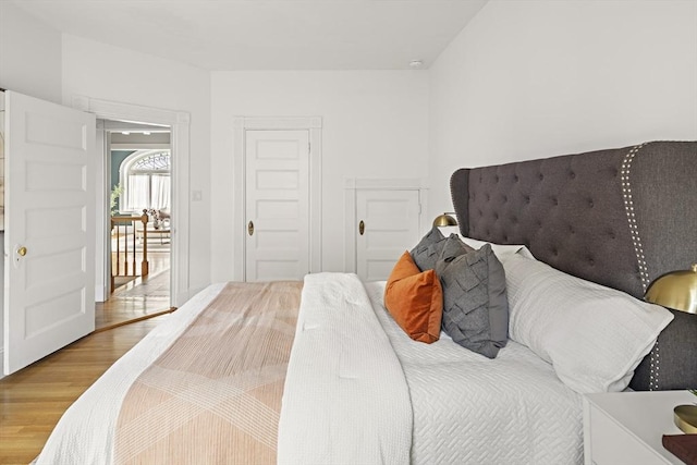 bedroom with wood finished floors