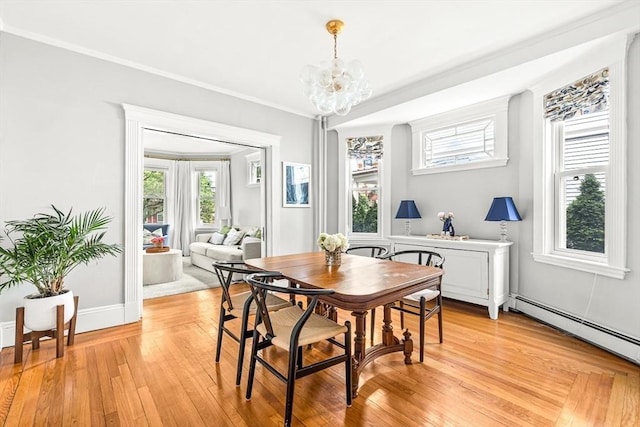 115 Westbourne Ter Unit 1, Brookline, MA 02446 - dining area with a chandelier, light wood-style flooring, baseboard heating, and ornamental molding